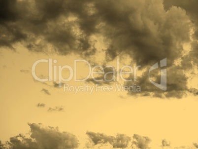 Blue sky with clouds background sepia