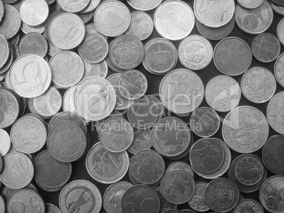 Many Euro coins in black and white