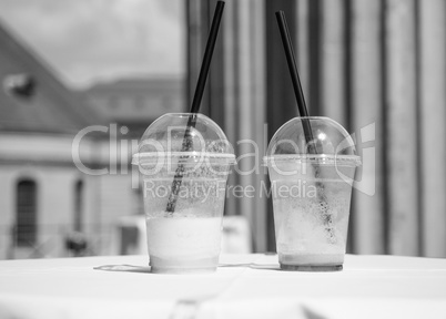 Cocktail glasses on a table in black and white