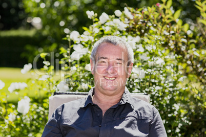 Man sitting on chair in the garden
