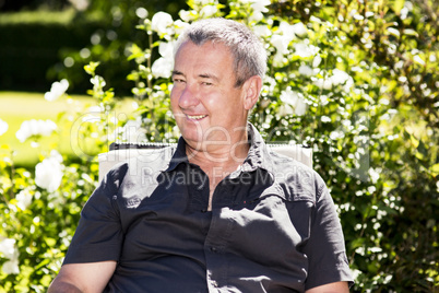 Man sitting on chair in the garden