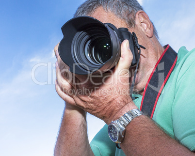 Photographer with a camera when photographing