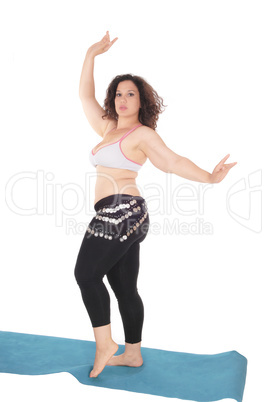 Belly dancing young woman.