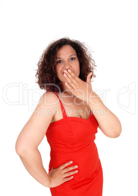 Shocked woman with hand over mouth.