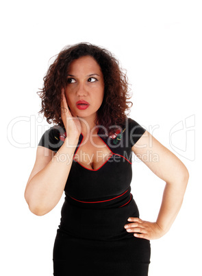 Shocked woman with hand on face.