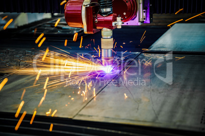 CNC Laser plasma cutting of metal, modern industrial technology.