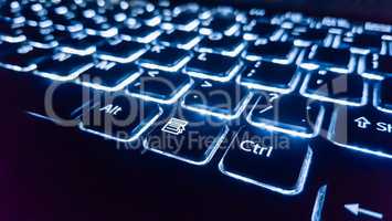 Neon keyboard with enter button. Focus on the  .