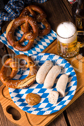 Bavarian sausage with pretzel, sweet mustard and beer