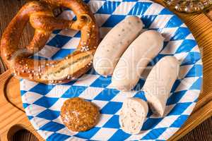 Bavarian sausage with pretzel, sweet mustard and beer