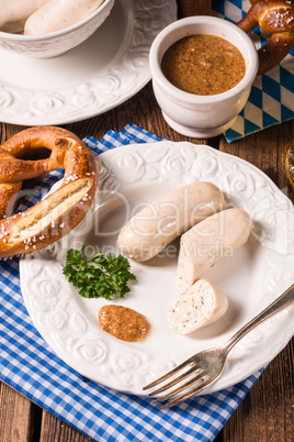 sausage with pretzel, sweet mustard and beer