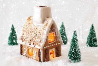 Gingerbread House On Snow With Snowflakes And White Background