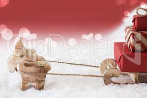 Reindeer With Sled, Red Bokeh Background, Copy Space