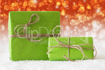 Two Green Gifts On Snow, Complementary Red Bokeh Effect