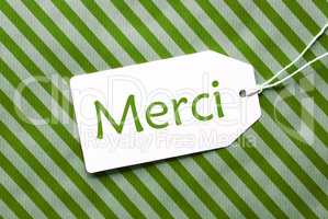 Label On Green Wrapping Paper, Merci Means Thank You