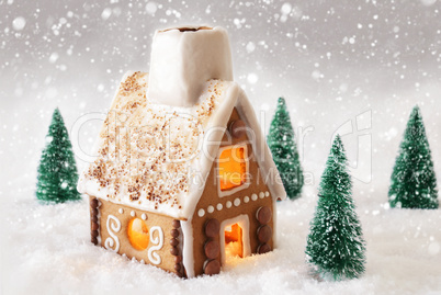 Gingerbread House On Snow With Snowflakes And Gray Background