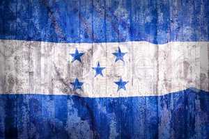 Grunge style of Honduras flag on a brick wall