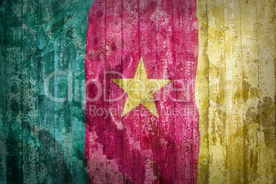 Grunge style of Cameroon flag on a brick wall