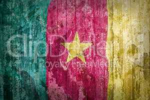 Grunge style of Cameroon flag on a brick wall