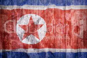 Grunge style of North Korea flag on a brick wall