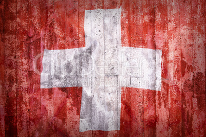 Grunge style of Switzerland flag on a brick wall