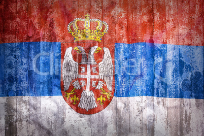 Grunge style of Serbia flag on a brick wall