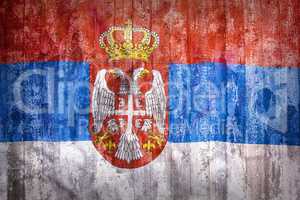 Grunge style of Serbia flag on a brick wall