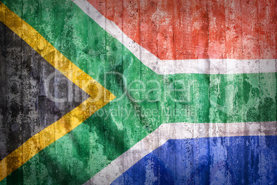 Grunge style of South Africa flag on a brick wall