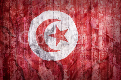 Grunge style of Tunisia flag on a brick wall