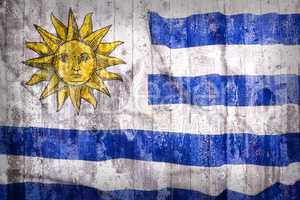 Grunge style of Uruguay flag on a brick wall