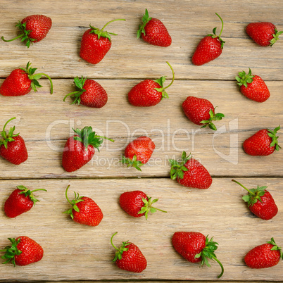 strawberries on a wooden surface background