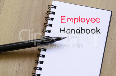 Employee handbook text concept on notebook