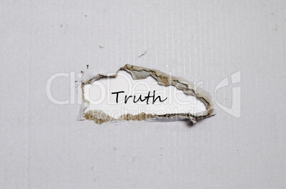 The word truth appearing behind torn paper