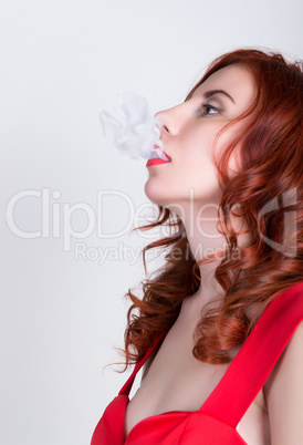 close-up portrait of a elegant young redhead woman, bright red lips, the smoke releases