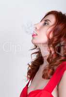 close-up portrait of a elegant young redhead woman, bright red lips, the smoke releases