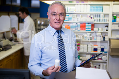 Pharmacist checking medicines