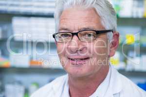 Smiling pharmacist in spectacles