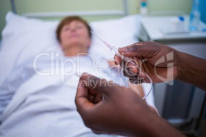 Nurse holding iv drip