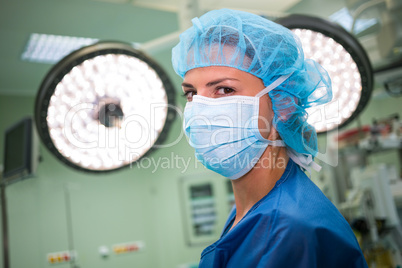 Portrait of a female surgeon wearing surgical mask and surgical