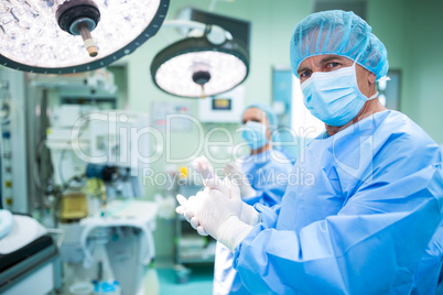 Surgeon applauding in operation room