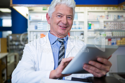 Pharmacist using a digital tablet