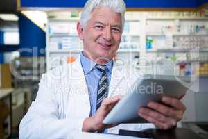 Pharmacist using a digital tablet