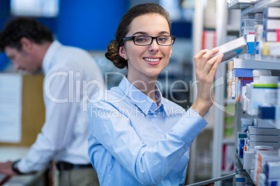 Pharmacist checking a medicine in pharmacy