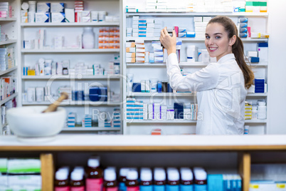 Pharmacist checking a medicine in pharmacy