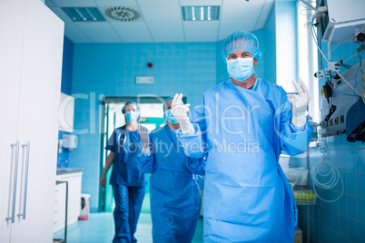 Surgeon walking in operation room