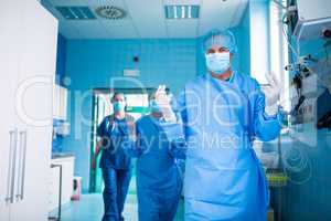 Surgeon walking in operation room