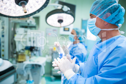 Surgeon applauding in operation room