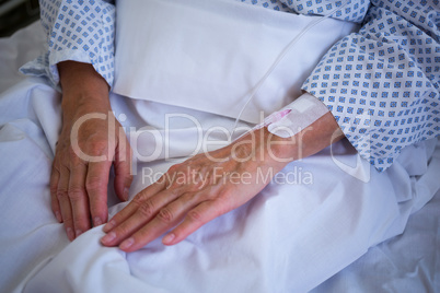 Close-up of patients hand with iv drip
