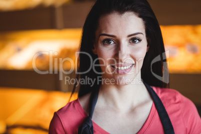 Portrait of female baker smiling