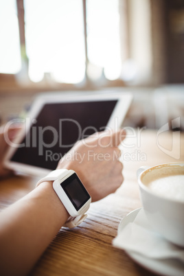 Hands of woman using digital tablet