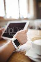 Hands of woman using digital tablet